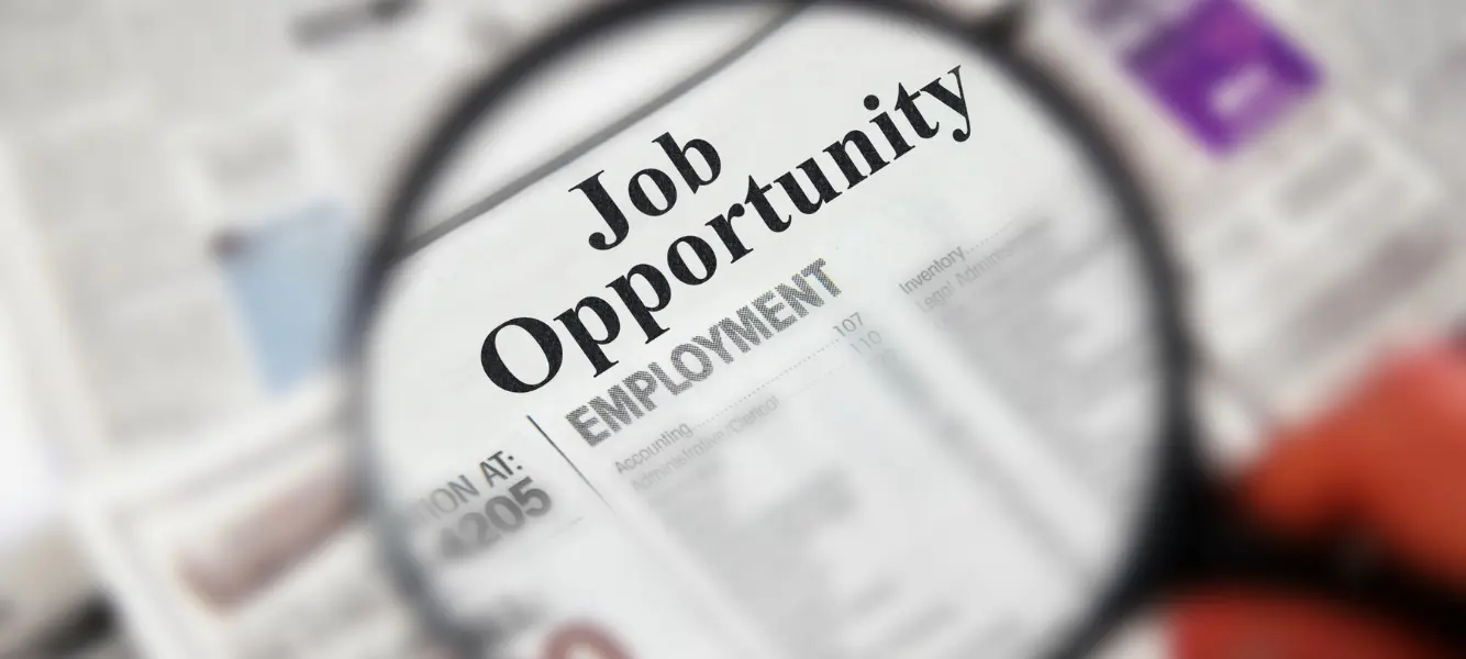 a newspaper showing US job openings 2025